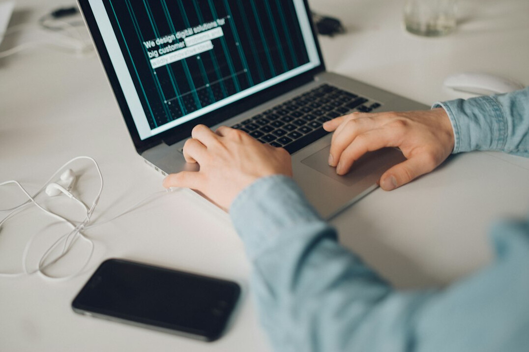 person analyzing data on laptop