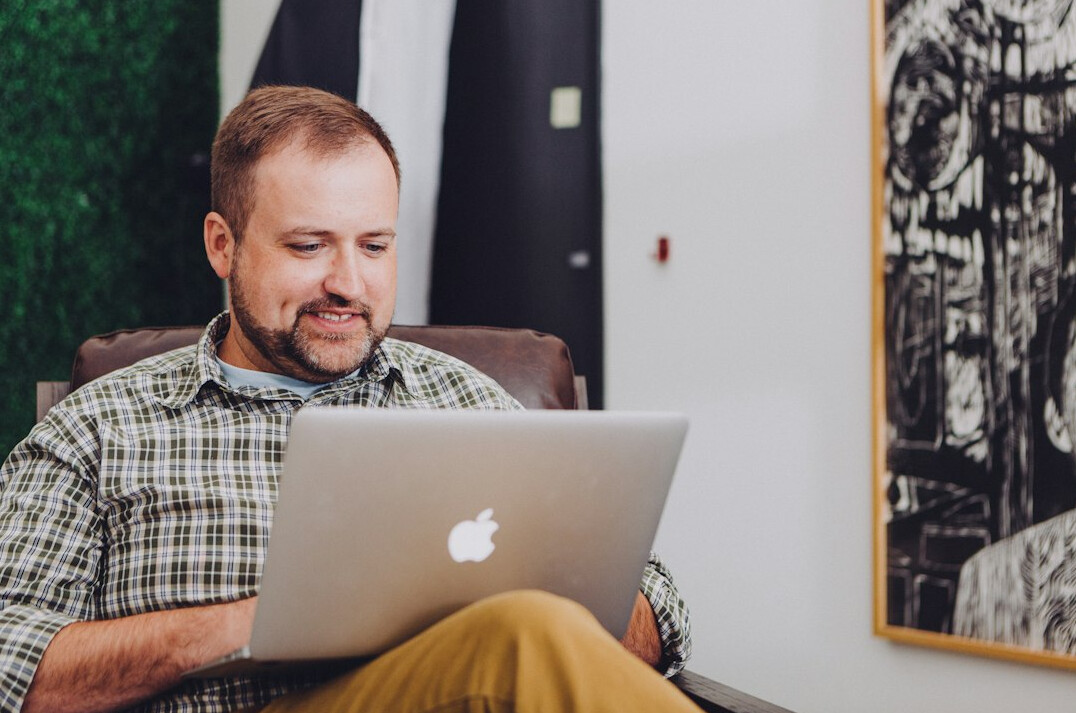 focused person working at laptop